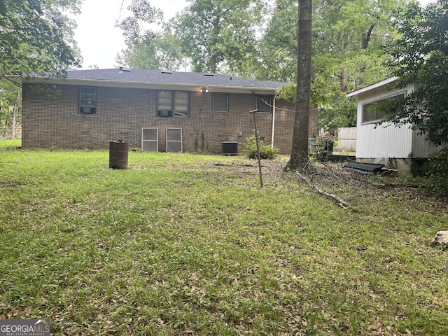 2526 Kensington Rd, Macon, GA 31211 - back of house featuring central air condition unit, brick siding, a lawn, and crawl space