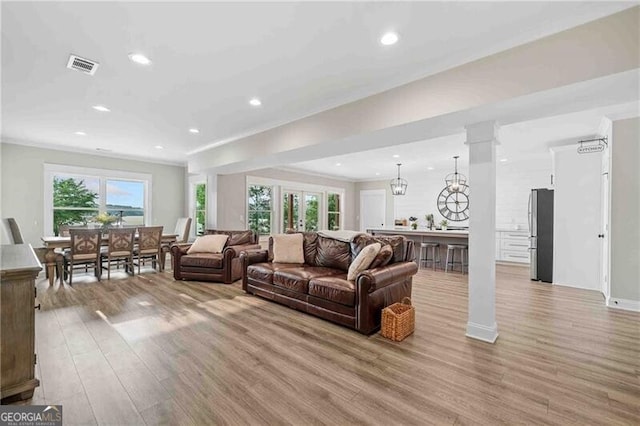 103 Jackson Ridge Dr, Monticello, GA 31064 - living room with light wood-style flooring, recessed lighting, and ornamental molding