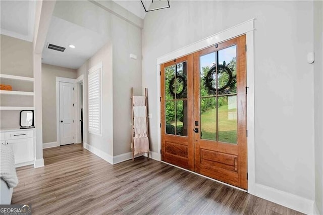 103 Jackson Ridge Dr, Monticello, GA 31064 - foyer featuring french doors, wood finished floors, baseboards, and recessed lighting