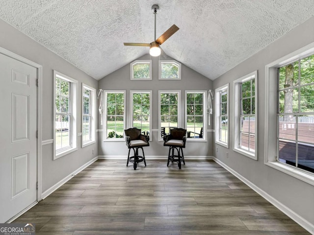 30 Court S, Ellenwood, GA 30294 - sunroom featuring a textured ceiling, healthy amount of natural light, wood finished floors, vaulted ceiling, and baseboards