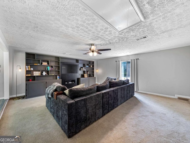 30 Court S, Ellenwood, GA 30294 - living area featuring attic access, light colored carpet, baseboards, a textured ceiling, and ceiling fan