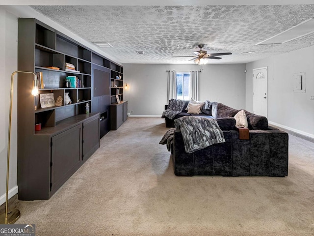 30 Court S, Ellenwood, GA 30294 - carpeted living room with baseboards, a textured ceiling, and ceiling fan