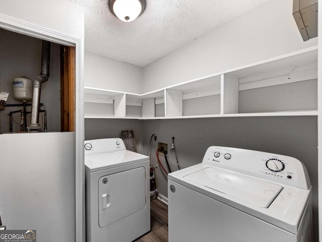 30 Court S, Ellenwood, GA 30294 - laundry area featuring washing machine and dryer, dark wood finished floors, water heater, and a textured ceiling