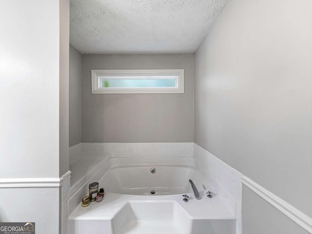 30 Court S, Ellenwood, GA 30294 - full bath with a garden tub and a textured ceiling