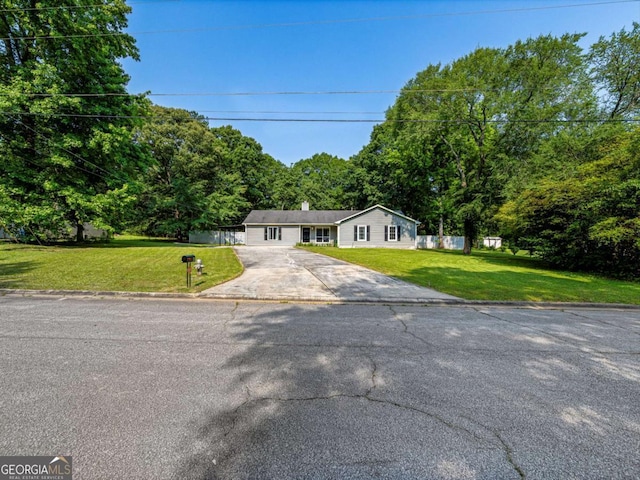 30 Court S, Ellenwood, GA 30294 - ranch-style home featuring asphalt driveway, a front yard, and a chimney