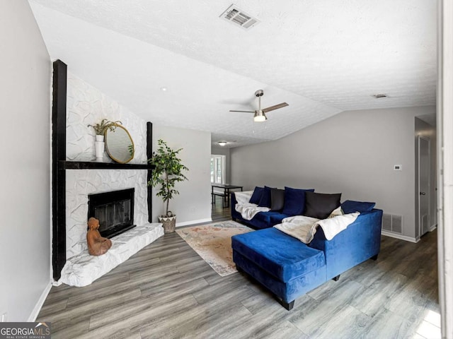 30 Court S, Ellenwood, GA 30294 - living area featuring baseboards, wood finished floors, vaulted ceiling, a textured ceiling, and a ceiling fan