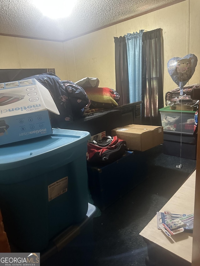 94 Payne Ln, Carnesville, GA 30521 - bedroom featuring washer / dryer and a textured ceiling