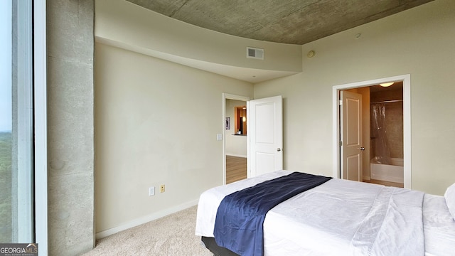 3300 Windy Ridge Pkwy SE, Atlanta, GA 30339 - bedroom with carpet floors, ensuite bath, and baseboards