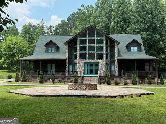 33 T J Mote Rd, Dahlonega, GA 30533 - view of front of home featuring stone siding, covered porch, a front lawn, and french doors