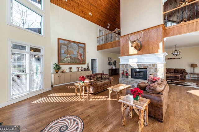 33 T J Mote Rd, Dahlonega, GA 30533 - living area with high vaulted ceiling, healthy amount of natural light, wood finished floors, a fireplace, and wooden ceiling
