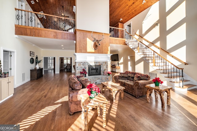 33 T J Mote Rd, Dahlonega, GA 30533 - living room featuring high vaulted ceiling, wooden ceiling, stairway, a stone fireplace, and wood finished floors