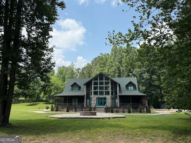 33 T J Mote Rd, Dahlonega, GA 30533 - back of property featuring a yard, covered porch, and stone siding