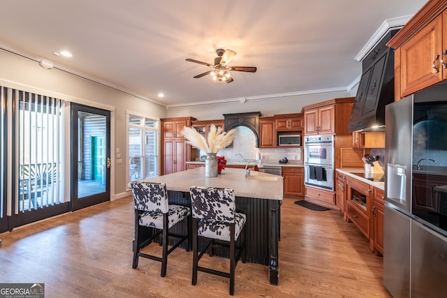 33 T J Mote Rd, Dahlonega, GA 30533 - kitchen with stainless steel appliances, healthy amount of natural light, light countertops, ceiling fan, and ornamental molding