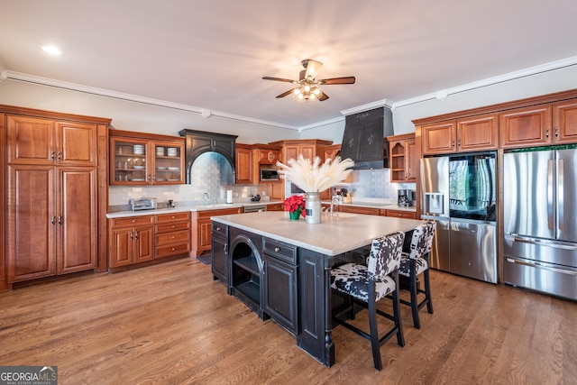 33 T J Mote Rd, Dahlonega, GA 30533 - kitchen with stainless steel appliances, brown cabinetry, light countertops, and crown molding