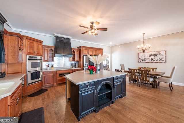 33 T J Mote Rd, Dahlonega, GA 30533 - kitchen with open shelves, double oven, brown cabinetry, light countertops, and a ceiling fan