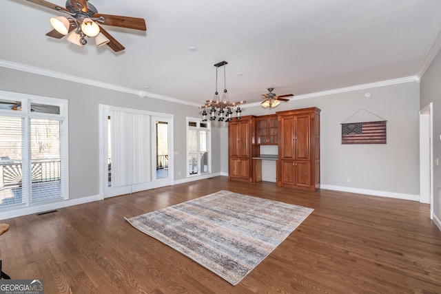 33 T J Mote Rd, Dahlonega, GA 30533 - unfurnished living room featuring a ceiling fan, ornamental molding, baseboards, and dark wood-style floors