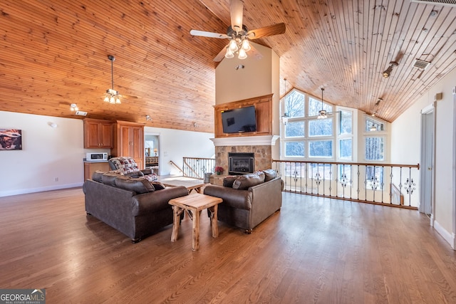 33 T J Mote Rd, Dahlonega, GA 30533 - living area with a ceiling fan, high vaulted ceiling, a glass covered fireplace, baseboards, and wooden ceiling