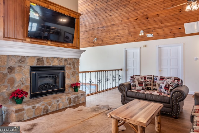 33 T J Mote Rd, Dahlonega, GA 30533 - living area featuring wood finished floors, high vaulted ceiling, and a fireplace