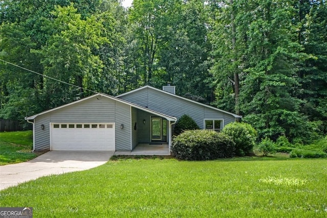 4766 Jamerson Forest Cir, Marietta, GA 30066 - view of front of home featuring a garage, driveway, a chimney, and a front yard