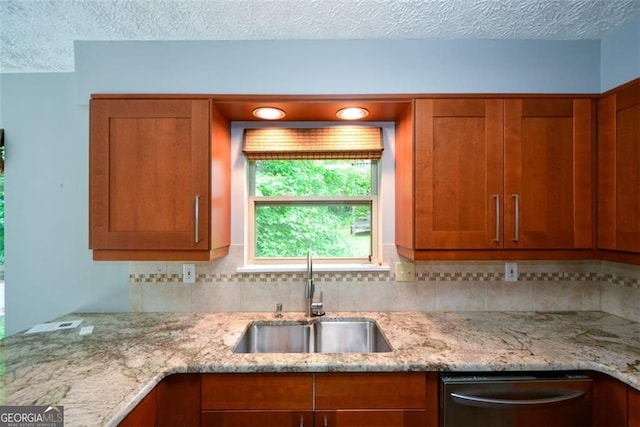 4766 Jamerson Forest Cir, Marietta, GA 30066 - kitchen with dishwasher, a textured ceiling, tasteful backsplash, brown cabinets, and light stone countertops