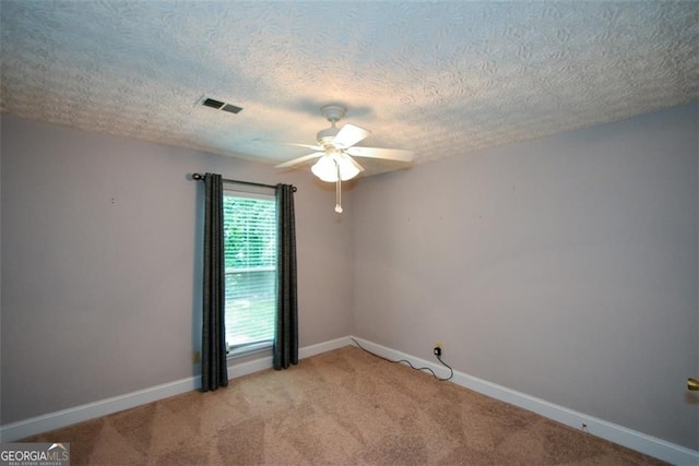 4766 Jamerson Forest Cir, Marietta, GA 30066 - spare room with a ceiling fan, light carpet, and a textured ceiling