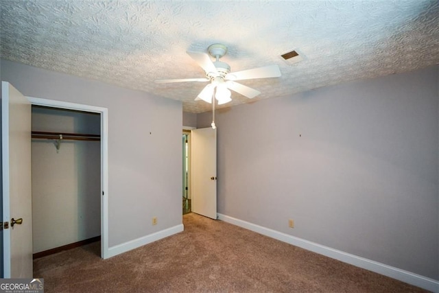 4766 Jamerson Forest Cir, Marietta, GA 30066 - unfurnished bedroom featuring carpet flooring, a closet, a textured ceiling, and ceiling fan