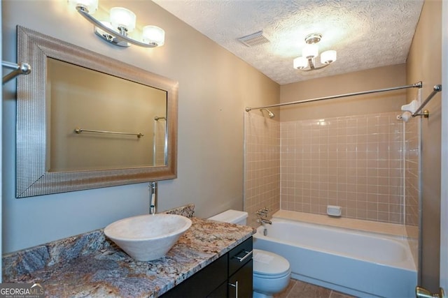 4766 Jamerson Forest Cir, Marietta, GA 30066 - bathroom featuring vanity, shower / washtub combination, a textured ceiling, and tile patterned flooring
