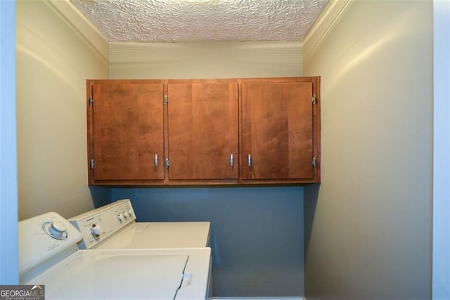 4766 Jamerson Forest Cir, Marietta, GA 30066 - laundry room with separate washer and dryer, cabinet space, and a textured ceiling