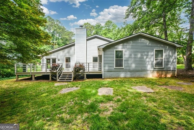 4766 Jamerson Forest Cir, Marietta, GA 30066 - back of property featuring a wooden deck, a chimney, and a yard