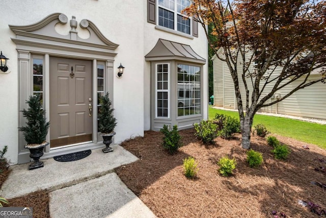 144 Nocatee Trl, Woodstock, GA 30188 - doorway to property featuring stucco siding and a standing seam roof