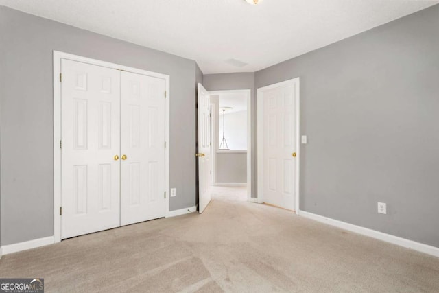 144 Nocatee Trl, Woodstock, GA 30188 - unfurnished bedroom with a closet and carpet floors