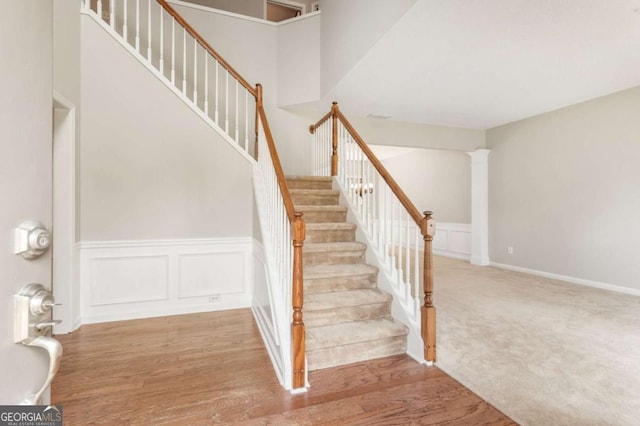 144 Nocatee Trl, Woodstock, GA 30188 - stairway featuring wood finished floors and a decorative wall