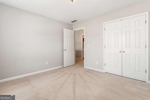 144 Nocatee Trl, Woodstock, GA 30188 - unfurnished bedroom featuring carpet floors and a closet