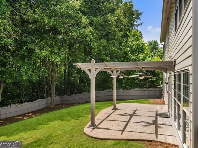 144 Nocatee Trl, Woodstock, GA 30188 - fenced backyard with ceiling fan and a patio area