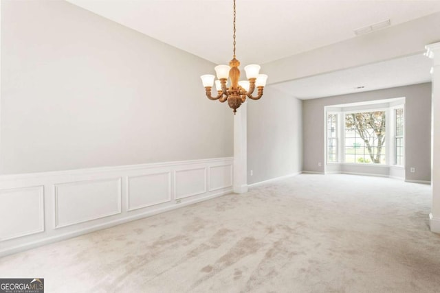 144 Nocatee Trl, Woodstock, GA 30188 - carpeted spare room with a chandelier and baseboards