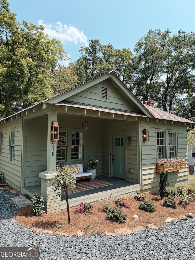 218 E Marable St, Monroe, GA 30655 - bungalow-style home with a porch and a chimney