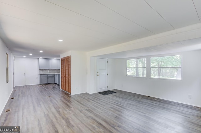 2526 Bald Eagle Trl, Gainesville, GA 30507 - unfurnished living room featuring wood finished floors, baseboards, and recessed lighting