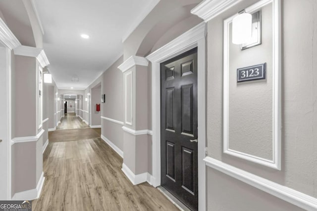 1850 Cotillion Dr Unit 3123, Atlanta, GA 30338 - corridor featuring light wood-type flooring, arched walkways, recessed lighting, and decorative columns