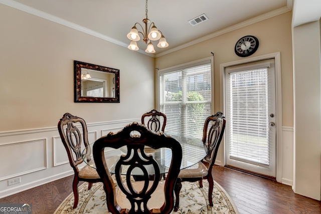 5016 Garrett Ct, Alpharetta, GA 30005 - dining area featuring a chandelier, wainscoting, crown molding, and dark wood-style flooring