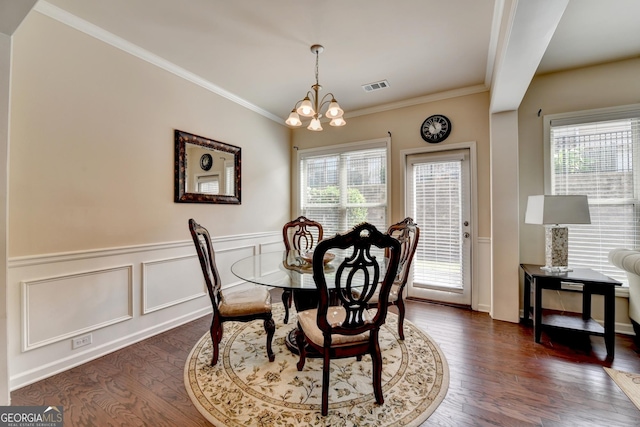 5016 Garrett Ct, Alpharetta, GA 30005 - dining space with a chandelier, wainscoting, dark wood-style floors, and crown molding