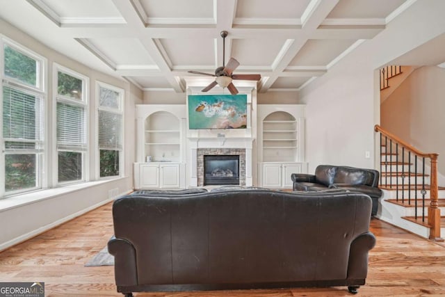 1979 Alcovy Shoals Blf, Lawrenceville, GA 30045 - living area featuring light wood-style flooring, stairway, a ceiling fan, healthy amount of natural light, and coffered ceiling