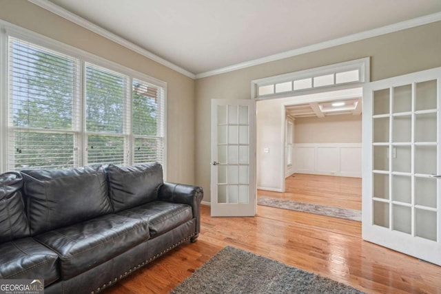 1979 Alcovy Shoals Blf, Lawrenceville, GA 30045 - living area with wood finished floors, crown molding, and french doors