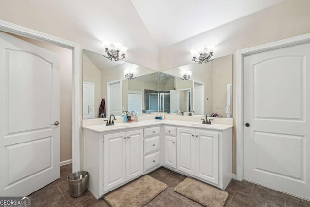 1979 Alcovy Shoals Blf, Lawrenceville, GA 30045 - full bathroom with vaulted ceiling, double vanity, a chandelier, and tile patterned floors