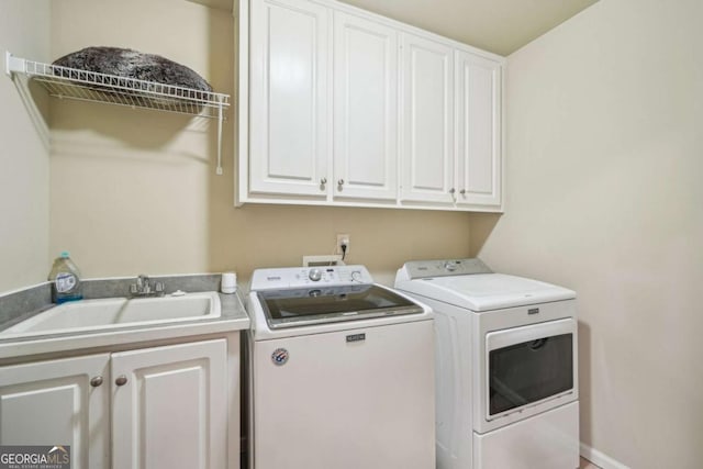 1979 Alcovy Shoals Blf, Lawrenceville, GA 30045 - washroom featuring washing machine and dryer and cabinet space