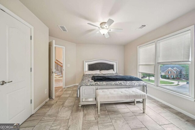 1979 Alcovy Shoals Blf, Lawrenceville, GA 30045 - bedroom with a ceiling fan and light marble finish flooring