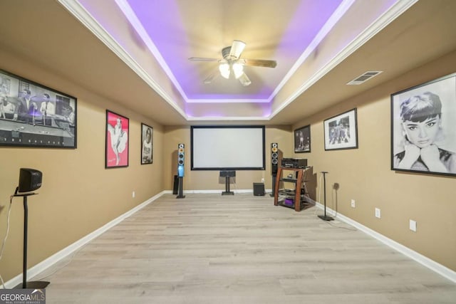 1979 Alcovy Shoals Blf, Lawrenceville, GA 30045 - home theater with a raised ceiling, a ceiling fan, light wood-type flooring, and ornamental molding