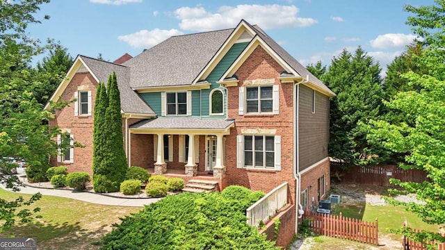 1979 Alcovy Shoals Blf, Lawrenceville, GA 30045 - craftsman house with brick siding, covered porch, and roof with shingles