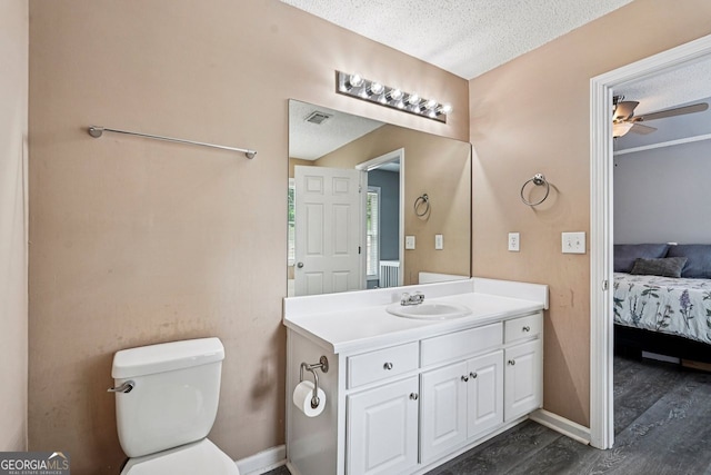 1415 Langdon Park Ct, Winder, GA 30680 - bathroom featuring vanity, ensuite bath, wood finished floors, ceiling fan, and a textured ceiling