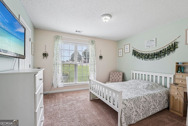 1415 Langdon Park Ct, Winder, GA 30680 - bedroom featuring carpet floors and a textured ceiling