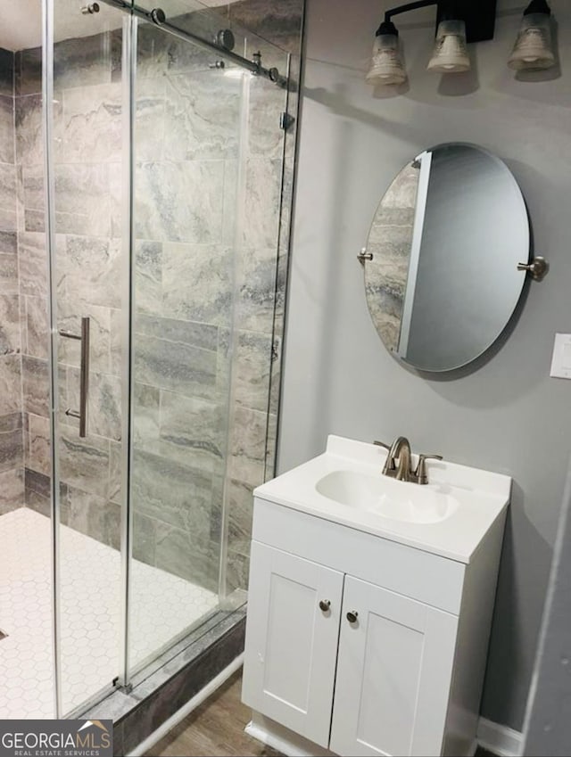 405 N Ave, Warner Robins, GA 31093 - bathroom featuring a shower stall, vanity, and wood finished floors